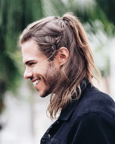 The bangs follow gravity and cover the forehead. . Best hairstyles for men with long hair
